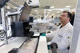 President Macron Visits EssilorLuxottica Laboratory - Wissous