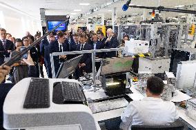 President Macron Visits EssilorLuxottica Laboratory - Wissous