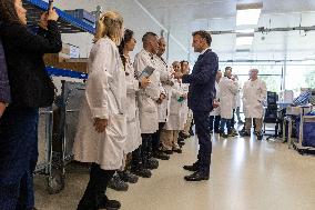 President Macron Visits EssilorLuxottica Laboratory - Wissous