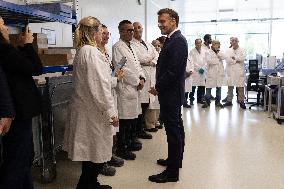 President Macron Visits EssilorLuxottica Laboratory - Wissous