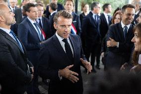 President Macron Visits EssilorLuxottica Laboratory - Wissous