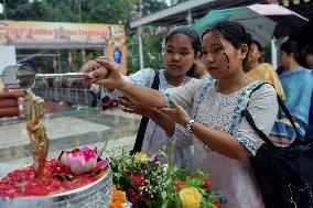 Devotees Pray at Buddha Temple - India