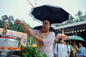 Devotees Pray at Buddha Temple - India