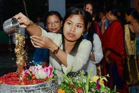 Devotees Pray at Buddha Temple - India