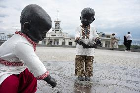 Statues of baby founders of Kyiv in vyshyvankas