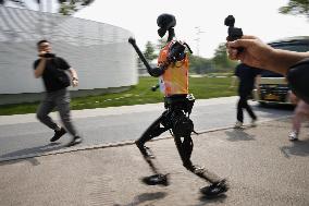 Winner of world's first humanoid half marathon