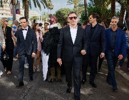 Cannes Raphael Quenard, Francois Civil, Michel Hazanavicius walk with condor from Hotel Martinez MP