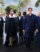 Cannes Raphael Quenard, Francois Civil, Michel Hazanavicius walk with condor from Hotel Martinez MP