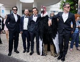 Cannes Raphael Quenard, Francois Civil, Michel Hazanavicius walk with condor from Hotel Martinez MP