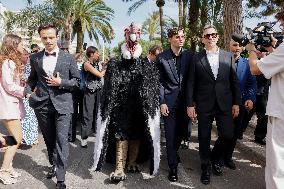 Cannes Raphael Quenard, Francois Civil, Michel Hazanavicius walk with condor from Hotel Martinez MP