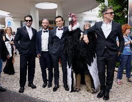 Cannes Raphael Quenard, Francois Civil, Michel Hazanavicius walk with condor from Hotel Martinez MP