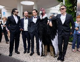 Cannes Raphael Quenard, Francois Civil, Michel Hazanavicius walk with condor from Hotel Martinez MP
