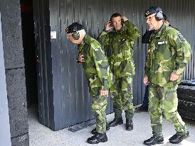 KING CARL GUSTAF VISITS SWEDISH NATO SOLDIERS