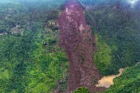 Nearly a Dozen Trapped in Landslides in Southwest China