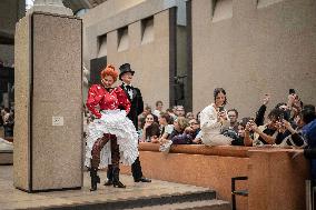 Moulin Rouge dancers perform at the Musee d'Orsay