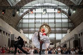Moulin Rouge dancers perform at the Musee d'Orsay