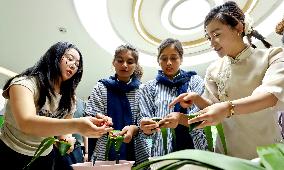 Foreigners Experience China Dragon Boat Festival