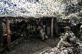 Ukrainian artillery personnel fight in Zaporizhzhia region