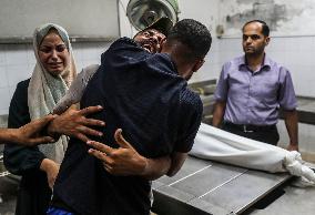 Palestinian Man Mourns Airstrike Victim - Gaza