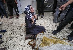 Palestinian Man Mourns Airstrike Victim - Gaza