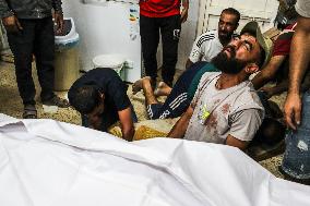 Palestinian Man Mourns Airstrike Victim - Gaza