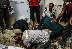 Palestinian Man Mourns Airstrike Victim - Gaza