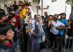 Palestinian Man Mourns Airstrike Victim - Gaza