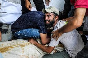 Palestinian Man Mourns Airstrike Victim - Gaza