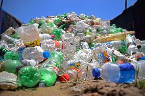 People Recycle Plastic Bottles - India
