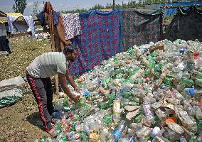 People Recycle Plastic Bottles - India