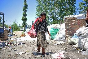 People Recycle Plastic Bottles - India