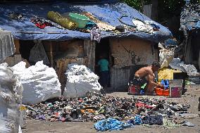 People Recycle Plastic Bottles - India