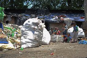 People Recycle Plastic Bottles - India