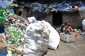 People Recycle Plastic Bottles - India