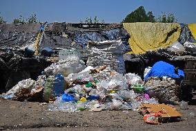 People Recycle Plastic Bottles - India