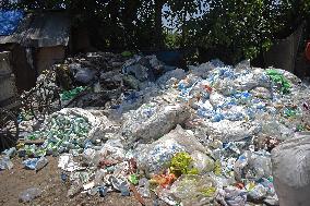 People Recycle Plastic Bottles - India