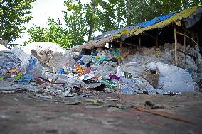 People Recycle Plastic Bottles - India