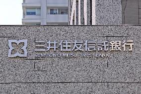Sumitomo Mitsui Trust Bank signage and logo