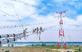 Workers on Power Transmission Line - China