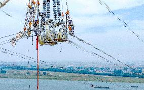 Workers on Power Transmission Line - China