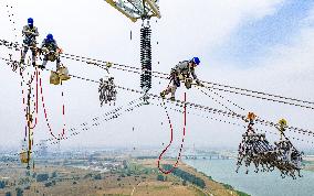 Workers on Power Transmission Line - China