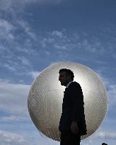 Macron Visits The Olympic Cauldron Reinstallation Site - Paris