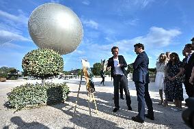 Macron Visits The Olympic Cauldron Reinstallation Site - Paris