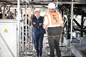 Macron Visits The Olympic Cauldron Reinstallation Site - Paris