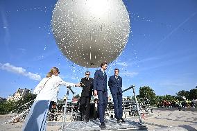 Macron Visits The Olympic Cauldron Reinstallation Site - Paris
