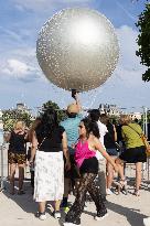 Emmanuel Macron visits the Olympic cauldron at the Tuileries - Paris