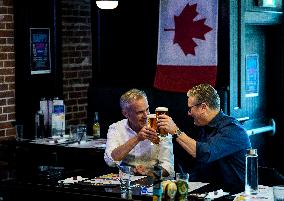 Carney And Starmer Watch Ice Hockey Match in Pub - Ottawa