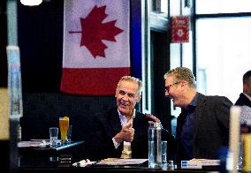 Carney And Starmer Watch Ice Hockey Match in Pub - Ottawa