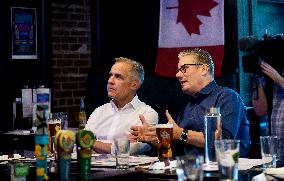 Carney And Starmer Watch Ice Hockey Match in Pub - Ottawa