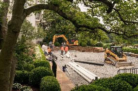 Workers Reconstruct the Rose Garden to Pavement at the White House